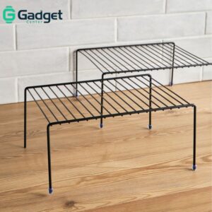Black metal wire cabinet storage shelf rack or kitchen organizer, commonly used for maximizing storage space in cabinets or on countertops